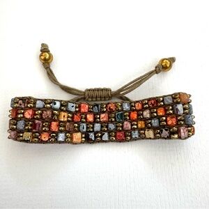 Beaded Bracelet with Distressed Design and Adjustable Cord. Excellent Condition!